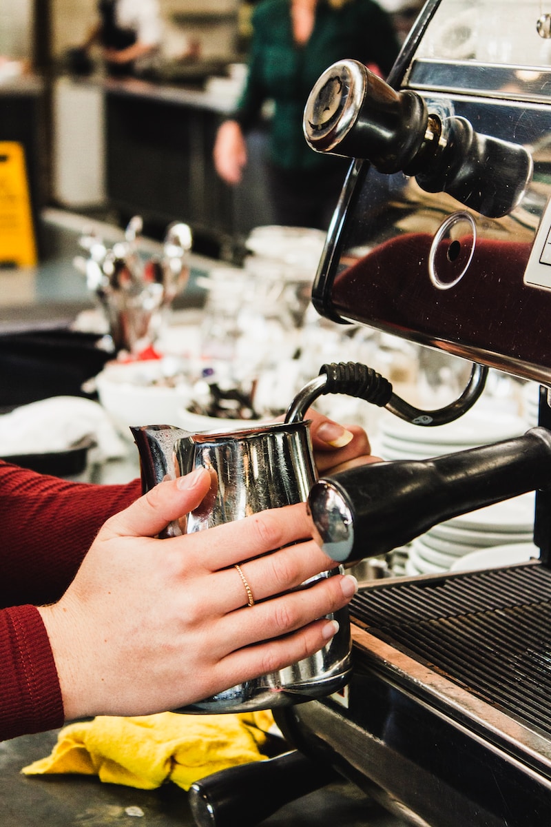 person making coffee